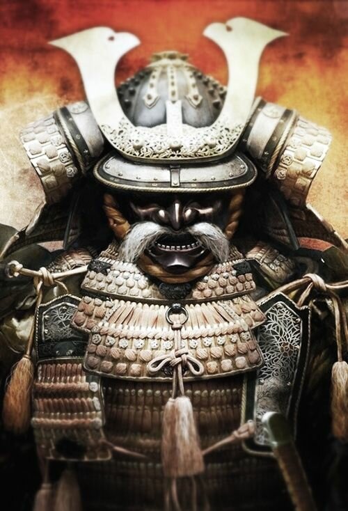 Samurai armor close-up with fierce whiskered face mask, white helmet crest, and layered scale plating